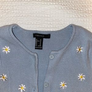 Blue Cardigan with Flower printed on it